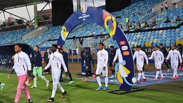 Ecuador's and Peru' football teams enter the field for their Conmebol Copa America 2021 football tournament group phase match at the Olympic Stadium in Goiania, Brazil, on June 23, 2021. (Photo by NELSON ALMEIDA / AFP)