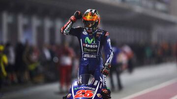 Movistar Yamaha MotoGP's Spanish rider Maverick Vinales celebrates after winning the 2017 Qatar MotoGP at the Losail International Circuit, north of the capital Doha on March 26, 2017.
Spain's Maverick Vinales of Movistar Yamaha MotoGP won the season-opening Qatar MotoGP on March 26, 2017, shrugging off a poor start from pole position under the desert floodlights. Defending world champion Marc Marquez was fourth on a Honda. / AFP PHOTO / Karim JAAFAR