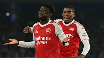 Arsenal's English midfielder #07 Bukayo Saka (L) celebrates after scoring the opening goal of the English Premier League football match between Brighton and Hove Albion and Arsenal at the American Express Community Stadium in Brighton, southern England on March 4, 2026. (Photo by Glyn KIRK / AFP) / RESTRICTED TO EDITORIAL USE. No use with unauthorized audio, video, data, fixture lists, club/league logos or 'live' services. Online in-match use limited to 120 images. An additional 40 images may be used in extra time. No video emulation. Social media in-match use limited to 120 images. An additional 40 images may be used in extra time. No use in betting publications, games or single club/league/player publications. /