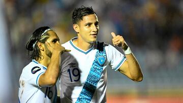 Guatemala's forward Jos� Mart�nez (R) celebrates with teammate defender Jos� Morales after scoring during the Concacaf Nations League group stage football match between Guatemala and Martinique at the Doroteo Gamuch Flores stadium in Guatemala City, on September 5, 2024. (Photo by JOHAN ORDONEZ / AFP)