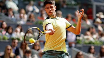 Spain's Carlos Alcaraz returns to Brazil's Thiago Seyboth Wild during the third round of the 2024 ATP Tour Madrid Open tournament tennis match at Caja Magica in Madrid on April 28, 2024. (Photo by OSCAR DEL POZO / AFP)