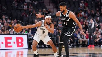 Dec 19, 2019; San Antonio, TX, USA; San Antonio Spurs guard Patty Mills (8) drives past Brooklyn Nets guard Garrett Temple (17) during the second half at the AT&T Center. Mandatory Credit: Daniel Dunn-USA TODAY Sports