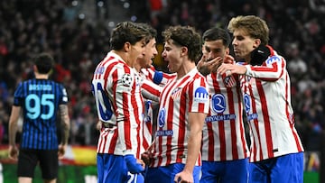Atletico Madrid's Argentine forward #19 Julian Alvarez (2L) celebrates with teammate Atletico Madrid's Argentine forward #20 Giuliano Simeone after scoring their first goal during the UEFA Champions League, league phase day 5 football match between Club Atletico de Madrid and Inter Milan at the Metropolitano Stadium in Madrid on November 26, 2025. (Photo by Javier SORIANO / AFP)