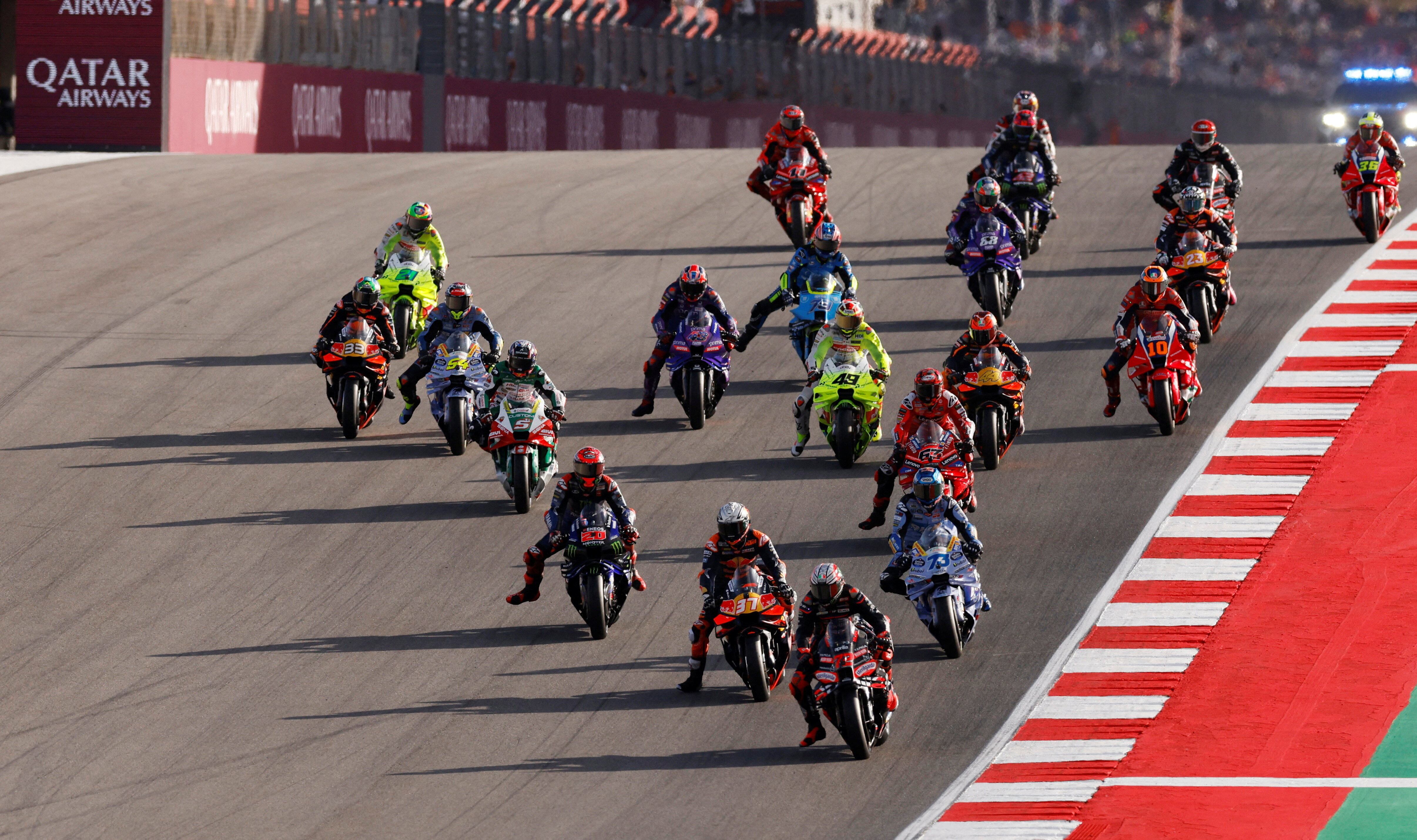 MotoGP - Portuguese Grand Prix - Algarve International Circuit, Portimao, Portugal - November 8, 2025 Aprilia Racing's Marco Bezzecchi leads at the start of the sprint race REUTERS/Marcelo Del Pozo TPX IMAGES OF THE DAY