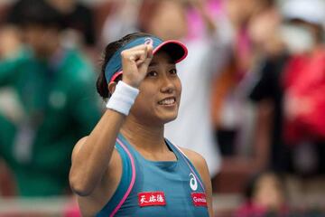 Wang Shuai celebrates after beating Angelique Kerber.