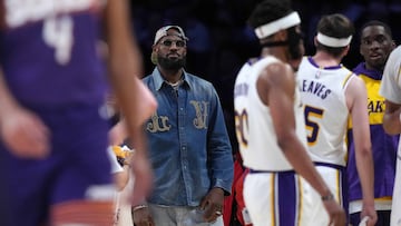 Mar 16, 2025; Los Angeles, California, USA; Los Angeles Lakers forward LeBron James watches from the bench against the Phoenix Suns in the second half at Crypto.com Arena. Mandatory Credit: Kirby Lee-Imagn Images