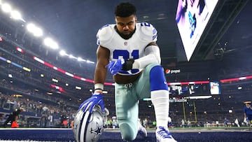 ARLINGTON, TX - DECEMBER 26: Ezekiel Elliott #21 of the Dallas Cowboys takes a knee in the end zone before the Cowboys played the Detroit Lions at AT&amp;T Stadium on December 26, 2016 in Arlington, Texas. (Photo by Tom Pennington/Getty Images)