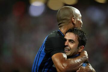 Eder celebrates with teammate Joao Mario after scoring.