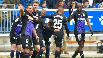 Leganes' Argentinian defender Jonathan Silva (L) celebrates with teammtes after scoring during the Spanish league football match between Deportivo Alaves and CD Leganes at the Mendizorroza stadium in Vitoria on April 7, 2019. (Photo by ANDER GILLENE