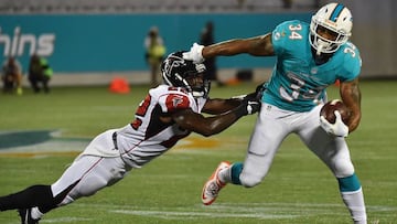 Aug 25, 2016; Orlando, FL, USA; Miami Dolphins running back Arian Foster (34) runs with the ball away from Atlanta Falcons strong safety Keanu Neal (22) during the first half at Camping World Stadium. Mandatory Credit: Jasen Vinlove-USA TODAY Sports