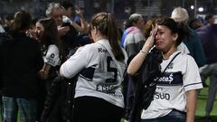 Fans of Gimnasia y Esgrima react after the incidents outside the Juan Carmelo Zerillo stadium during the rgentine Professional Football League Tournament 2022 match between Gimnasia y Egrima and Boca Juniors in La Plata, Argentina, on October 6, 2022. - This Thursday's match between Gimnasia y Esgrima and Boca Juniors was suspended 9 minutes into the first half due to serious incidents outside the stadium that affected the development of the match. (Photo by ALEJANDRO PAGNI / AFP)