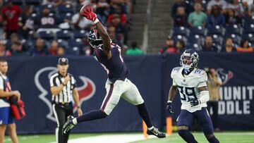 Oct 30, 2022; Houston, Texas, USA; Houston Texans wide receiver Brandin Cooks (13) makes a reception as Tennessee Titans cornerback Terrance Mitchell (39) defends during the fourth quarter at NRG Stadium. Mandatory Credit: Troy Taormina-USA TODAY Sports