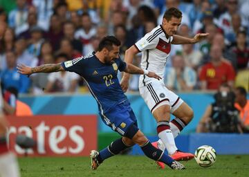 Ezequiel Lavezzi y Miroslav Klose.