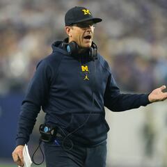 Why is the NCAA investigating Michigan’s football program and head coach Jim Harbaugh?