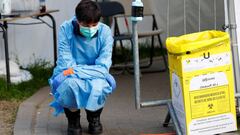 A medical worker waits to test people for coronavirus disease (COVID-19) outside the intensive care unit of a hospital, during the lockdown imposed by the Belgian government to slow down the coronavirus disease (COVID-19) spread, in Brussels, Belgium Apri