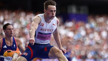 Norway's Karsten Warholm competes in the men's 400m hurdles semi-final of the athletics event at the Paris 2024 Olympic Games at Stade de France in Saint-Denis, north of Paris, on August 7, 2024. (Photo by Anne-Christine POUJOULAT / AFP)