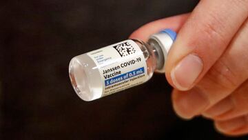 (FILES) In this file photo taken on March 5, 2021 registered nurse Florisa N. Lingad holds a Johnson & Johnson Janssen Covid-19 vaccine at a vaccination center established at the Hilton Chicago O'Hare Airport Hotel in Chicago, Illinois. - Top US health authorities recommended a "pause" in the use of the Johnson & Johnson Covid-19 vaccine "out of an abundance of caution" as they investigate any links between it and blood clots, a regulator said on April 13, 2021. The US Food and Drug Administration and the Centers for Disease Control are assessing the "potential significance" of six reported cases of a rare blood clot in patients who have received the shot, the FDA tweeted. (Photo by KAMIL KRZACZYNSKI / AFP)