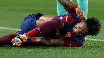 Barcelona's Brazilian forward #11 Raphinha reacts on the pitch during the Spanish league football match between FC Barcelona and RCD Mallorca at the Estadi Olimpic Lluis Companys in Barcelona on March 8, 2024. (Photo by LLUIS GENE / AFP)