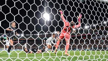 New Zealand's goalkeeper #21 Victoria Esson (R) concedes a goal scored by New Zealand's defender #07 Ali Riley (C) during the Australia and New Zealand 2023 Women's World Cup Group A football match between New Zealand and the Philippines at Wellington Stadium, also known as Sky Stadium, in Wellington on July 25, 2023. (Photo by Marty MELVILLE / AFP)