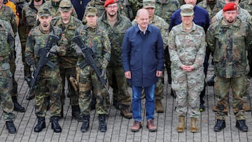 German Chancellor Olaf Scholz poses with members of the military during his visit to the Cologne-Bonn Air Force base to attend a demonstration of the capabilities of the Territorial Command of the German army Bundeswehr in Wahn, a suburb of Cologne, Germany, October 23, 2023.  REUTERS/Wolfgang Rattay
