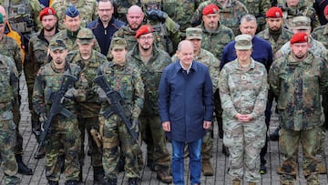 German Chancellor Olaf Scholz poses with members of the military during his visit to the Cologne-Bonn Air Force base to attend a demonstration of the capabilities of the Territorial Command of the German army Bundeswehr in Wahn, a suburb of Cologne, Germany, October 23, 2023.  REUTERS/Wolfgang Rattay