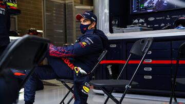 SPA, BELGIUM - AUGUST 29: Sergio Perez of Mexico and Red Bull Racing sits in the garage during the second red flag delay during the F1 Grand Prix of Belgium at Circuit de Spa-Francorchamps on August 29, 2021 in Spa, Belgium. (Photo by Mark Thompson/Getty