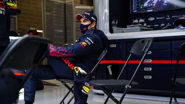 SPA, BELGIUM - AUGUST 29: Sergio Perez of Mexico and Red Bull Racing sits in the garage during the second red flag delay during the F1 Grand Prix of Belgium at Circuit de Spa-Francorchamps on August 29, 2021 in Spa, Belgium. (Photo by Mark Thompson/Getty 
