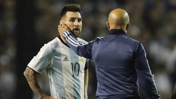 Argentina's Lionel Messi, left, is comforted by Argentina coach Jorge Sampaoli after a World Cup qualifying soccer match at La Bombonera stadium in Buenos Aires, Argentina, Thursday, Oct. 5, 2017. Argentina tied the match 0-0 and is almost eliminated from the upcoming World Cup in Russia. (AP Photo/Victor R. Caivano)