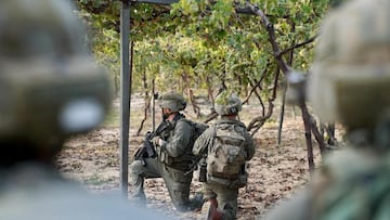 Israeli soldiers take position inside the Gaza Strip, amid the ongoing ground operation of the Israeli army against Palestinian Islamist group Hamas, according to the Israeli Defense Forces (IDF), in this handout picture obtained by Reuters on November 7, 2023. Israeli Defense Forces/Handout via REUTERS THIS IMAGE HAS BEEN SUPPLIED BY A THIRD PARTY