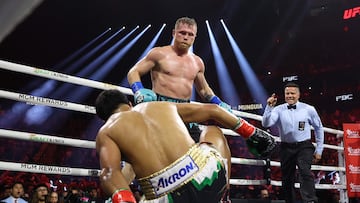 LAS VEGAS, NEVADA - MAY 04: Canelo Alvarez knocks down Jaime Munguia in their super middleweight championship title fight at T-Mobile Arena on May 04, 2024 in Las Vegas, Nevada.   Christian Petersen/Getty Images/AFP (Photo by Christian Petersen / GETTY IMAGES NORTH AMERICA / Getty Images via AFP)