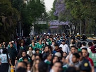 Fans walk near Azteca Stadium, officially renamed Estadio Banorte, on the day of a friendly match between the national teams of Mexico and Portugal held to mark the stadium's inauguration, as Mexico prepares for the 2026 FIFA World Cup co-hosted by the United States, Canada and Mexico, in Mexico City, Mexico, March 28, 2026. REUTERS/Quetzalli Nicte-Ha