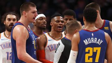 DENVER, COLORADO - DECEMBER 14: Russell Westbrook #0 of the Oklahoma Thunder is restrained by referee John Goble #30 from Jamal Murray #27 of the Denver Nuggets in the fourth quarter at the Pepsi Center on December 14, 2018 in Denver, Colorado. NOTE TO USER: User expressly acknowledges and agrees that, by downloading and or using this photograph, User is consenting to the terms and conditions of the Getty Images License Agreement.   Matthew Stockman/Getty Images/AFP
 == FOR NEWSPAPERS, INTERNET, TELCOS &amp; TELEVISION USE ONLY ==
