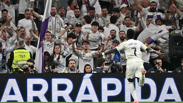 Real Madrid's Brazilian forward #07 Vinicius Junior celebrates scoring his team's third goal during the Spanish league football match between Real Madrid CF and Club Atletico de Madrid at Santiago Bernabeu Stadium in Madrid on March 22, 2026. (Photo by Javier SORIANO / AFP)