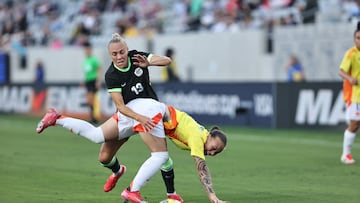 Feb 26, 2025; San Diego, California, USA; Colombia defender Ana Guzman (4) fights for ball against Australia midfielder Tameka Yallop (13) during the first half at Snapdragon Stadium. Mandatory Credit: Julia Kapros-Imagn Images