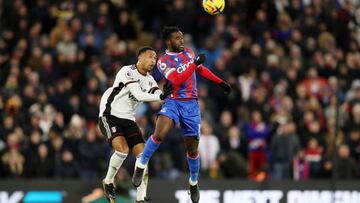 LONDON, ENGLAND - DECEMBER 26: Jeffrey Schlupp of Crystal Palace competes for a header with Kenny Tete of Fulham during the Premier League match between Crystal Palace and Fulham FC at Selhurst Park on December 26, 2022 in London, England. (Photo by Henry Browne/Getty Images)