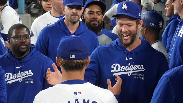May 7, 2024; Los Angeles, California, USA; Los Angeles Dodgers pitcher Yoshinobu Yamamoto (18) is congratulated by pitcher Clayton Kershaw (right) at the end of the eighth inning against the Miami Marlins at Dodger Stadium. Mandatory Credit: Kirby Lee-USA TODAY Sports