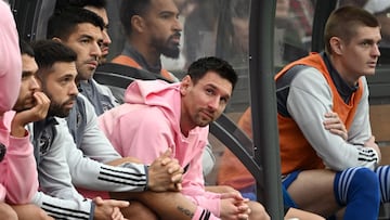 Inter Miami's Argentine forward Lionel Messi (C) sits on the bench during the friendly football match between Hong Kong XI and US Inter Miami CF in Hong Kong on February 4, 2024. Inter Miami were booed off the pitch after their injured superstar Lionel Messi failed to take the field in a pre-season friendly in Hong Kong. (Photo by Peter PARKS / AFP)
