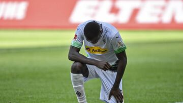 Moenchengladbach&#039;s Marcus Thuram taking the knee after scoring his side&#039;s second goal during the German Bundesliga soccer match between Borussia Moenchengladbach and Union Berlin in Moenchengladbach, Germany, Sunday, May 31, 2020. The German Bun