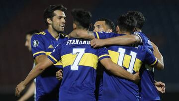 Argentina&#039;s Boca Juniors midfielder Eduardo Salvio celebrates with teammates after scoring against Paraguay&#039;s Libertad during their closed-door Copa Libertadores group phase football match at the La Nueva Olla stadium in Asuncion, on September 17, 2020, amid the COVID-19 novel coronavirus pandemic. (Photo by Jorge SAENZ / various sources / AFP)