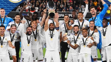 Real Madrid celebrate as Karim Benzema lifts the UEFA Super Cup trophy after victory over Eintracht Frankfurt at Helsinki Olympic Stadium.
