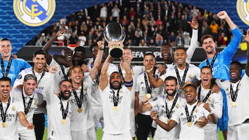 Real Madrid celebrate as Karim Benzema lifts the UEFA Super Cup trophy after victory over Eintracht Frankfurt at Helsinki Olympic Stadium.