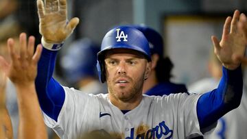 Aug 16, 2023; Los Angeles, California, USA;  Los Angeles Dodgers first baseman Freddie Freeman (5) is congratulated in the dugout after scoring a run in the sixth inning against the Milwaukee Brewers at Dodger Stadium. Mandatory Credit: Jayne Kamin-Oncea-USA TODAY Sports