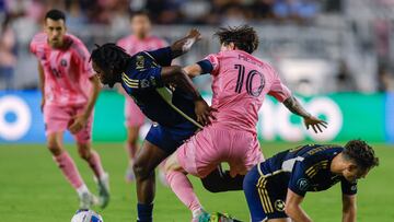 Inter Miami's Argentine forward #10 Lionel Messi fights for the ball with Vancouver Whitecaps US midfielder #16 Sebastian Berhalter (R) and Vancouver Whitecaps Cameroonian midfielder #26 JC Ngando during the CONCACAF Champions Cup semifinal football match between Inter Miami FC and the Vancouver Whitecaps FC, at Chase Stadium in Fort Lauderdale, Florida on April 30, 2025. (Photo by Chris Arjoon / AFP)