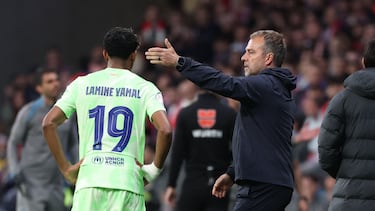 Barcelona's German coach Hans-Dieter Flick strokes Barcelona's Spanish forward #19 Lamine Yamal during the Spanish Copa del Rey (King's Cup) semi-final second leg football match between Club Atletico de Madrid and FC Barcelona at Metropolitano Stadium in Madrid on April 2, 2025. (Photo by Thomas COEX / AFP)