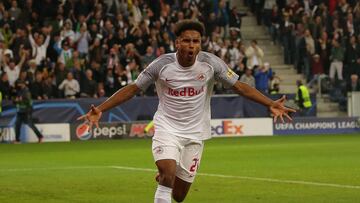 20 October 2021, Austria, Salzburg: Salzburg's Karim David Adeyemi celebrates scoring his side's first goal during the UEFA Champions League Group G soccer match between FC Red Bull Salzburg and VfL Wolfsburg at Red Bull Arena. Photo: Krugfoto/A