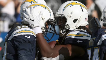 CARSON, CA - DECEMBER 31: Melvin Gordon #28 of the Los Angeles Chargers and Keenan Allen #13 of the Los Angeles Chargers celebrate after scoring a touchdown during the first half of the game against the Oakland Raiders at StubHub Center on December 31, 2017 in Carson, California.   Stephen Dunn/Getty Images/AFP
 == FOR NEWSPAPERS, INTERNET, TELCOS &amp; TELEVISION USE ONLY ==