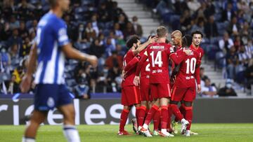 Soccer Football - Champions League - Group B - FC Porto v Liverpool - Estadio do Dragao, Porto, Portugal - September 28, 2021 Liverpool's Mohamed Salah celebrates scoring their third goal with teammates REUTERS/Pedro Nunes