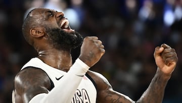 USA's #06 LeBron James celebrates at the end of the men's semifinal basketball match between USA and Serbia during the Paris 2024 Olympic Games at the Bercy Arena in Paris on August 8, 2024. (Photo by Aris MESSINIS / AFP)