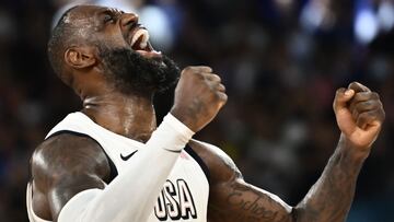 USA's #06 LeBron James celebrates at the end of the men's semifinal basketball match between USA and Serbia during the Paris 2024 Olympic Games at the Bercy Arena in Paris on August 8, 2024. (Photo by Aris MESSINIS / AFP)