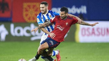 PAMPLONA, SPAIN - NOVEMBER 07: Ruben Garcia of CA Osasuna duels for the ball with Joseba Zaldua of Real Sociedad during the La Liga Santander match between CA Osasuna and Real Sociedad at Estadio El Sadar on November 07, 2021 in Pamplona, Spain. (Photo by